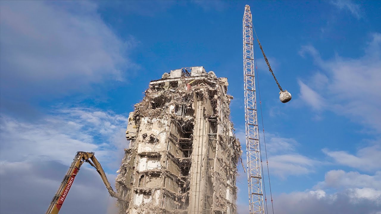 A Wrecking Ball Destroying A Tall Building